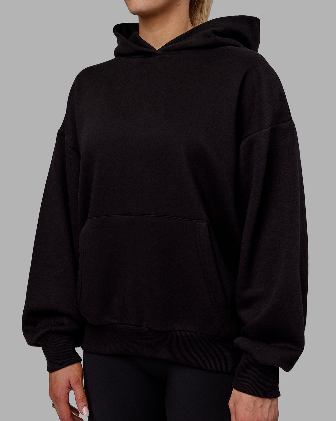 Woman wearing Sara Unisex Hoodie Oversize - Black-Black