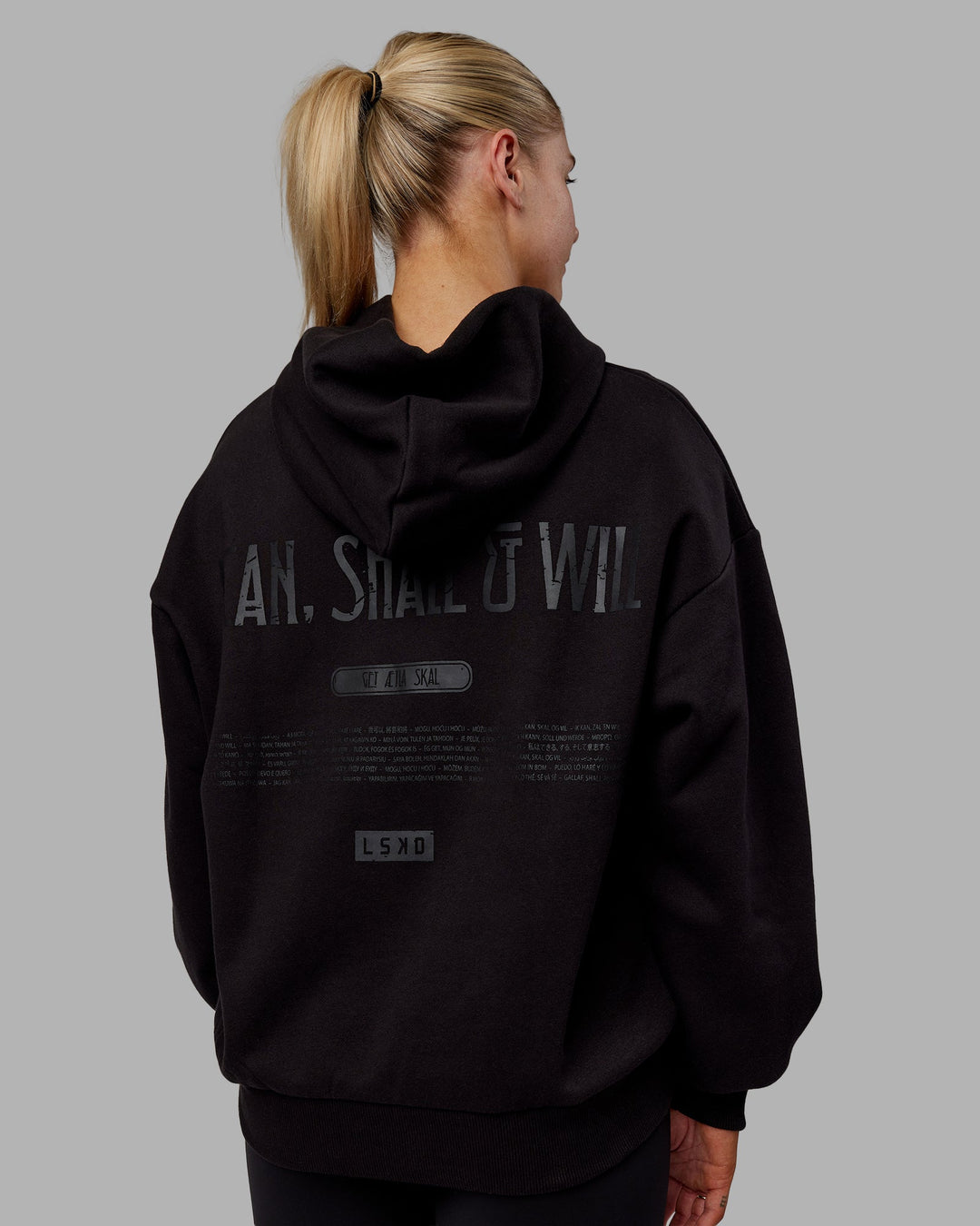 Woman wearing Sara Unisex Hoodie Oversize - Black-Black