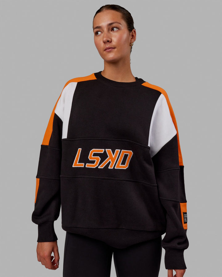 Woman wearing Unisex Slam Sweater Oversize - Black-Ultra Orange
