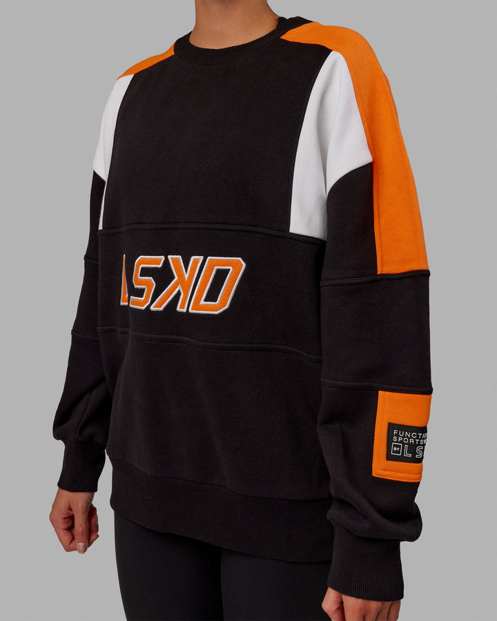 Woman wearing Unisex Slam Sweater Oversize - Black-Ultra Orange
