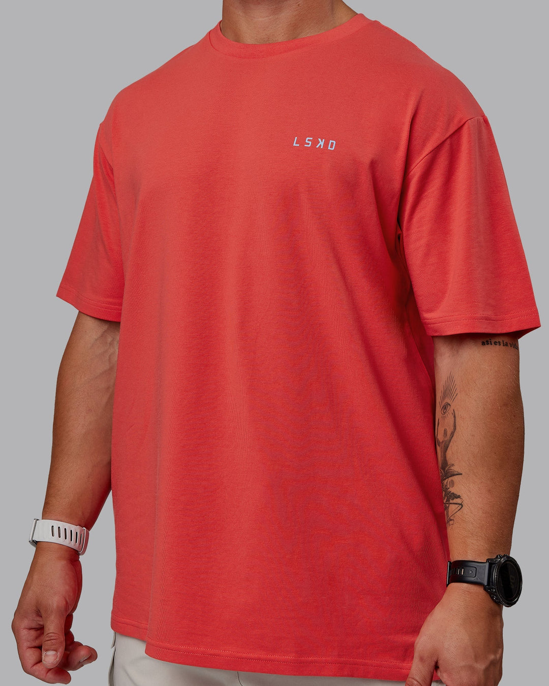 Man wearing Unisex Strike Through FLXCotton Tee Oversize - Cayenne-Glacial Blue