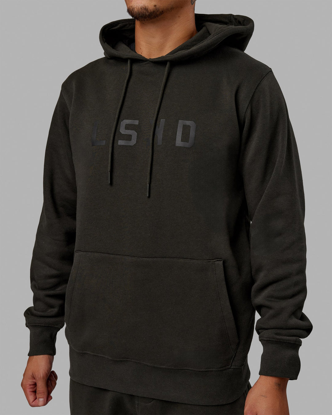 Man wearing Unisex Structure Hoodie - Pirate Black-Black