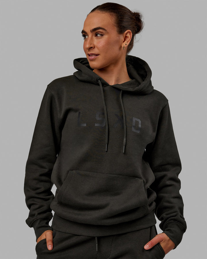 Woman wearing Unisex Structure Hoodie - Pirate Black-Black
