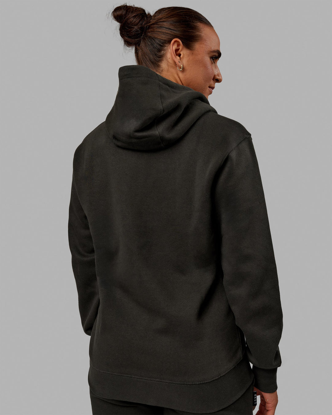 Woman wearing Unisex Structure Hoodie - Pirate Black-Black