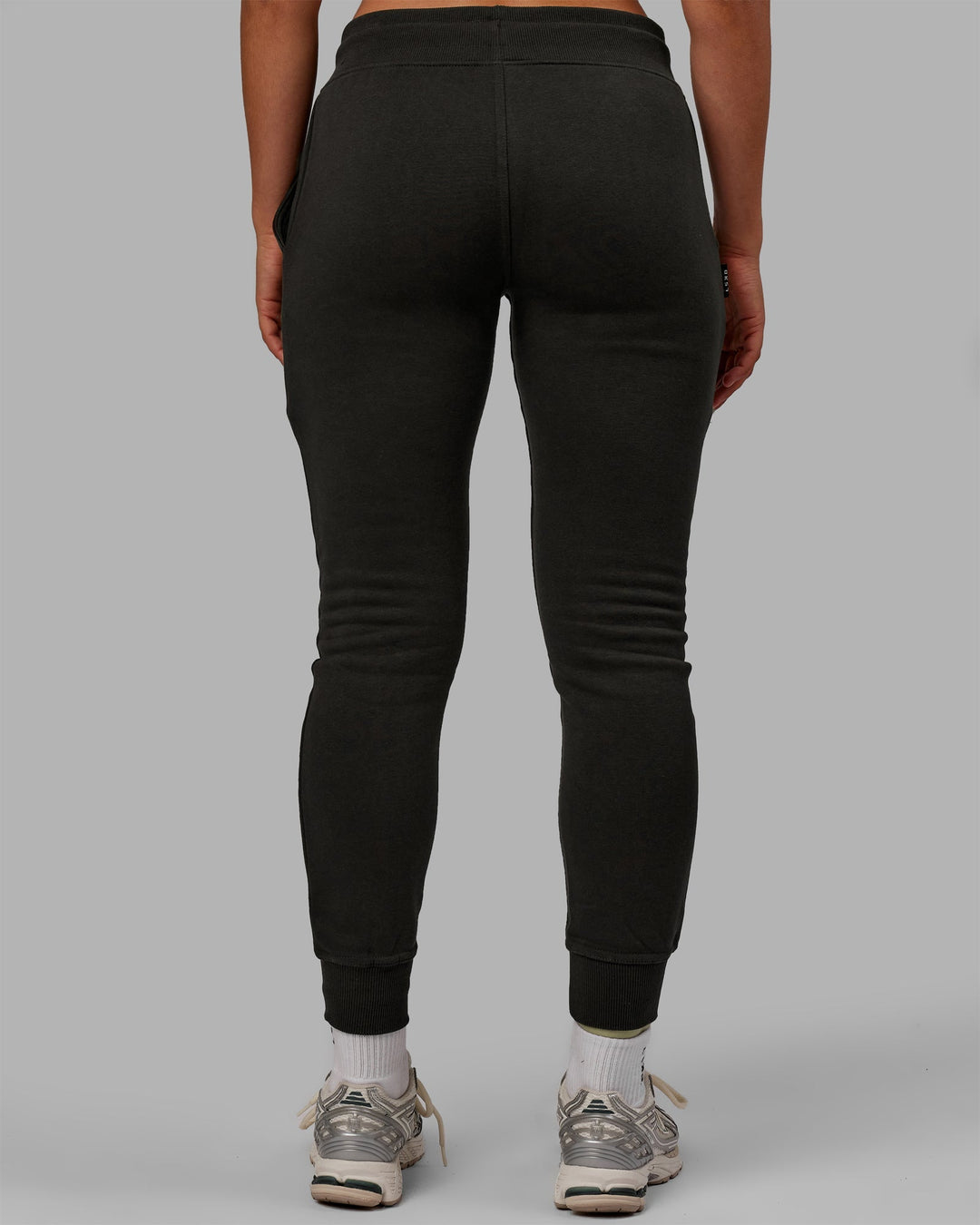 Woman wearing Unisex Structure Joggers - Pirate Black-Black