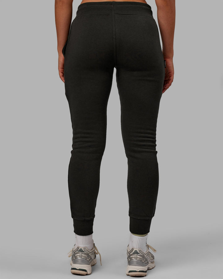 Woman wearing Unisex Structure Joggers - Pirate Black-Black
