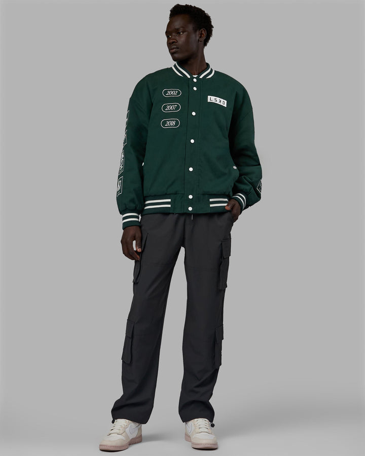 Man wearing Unisex Timeline Jacket - Vital Green-White