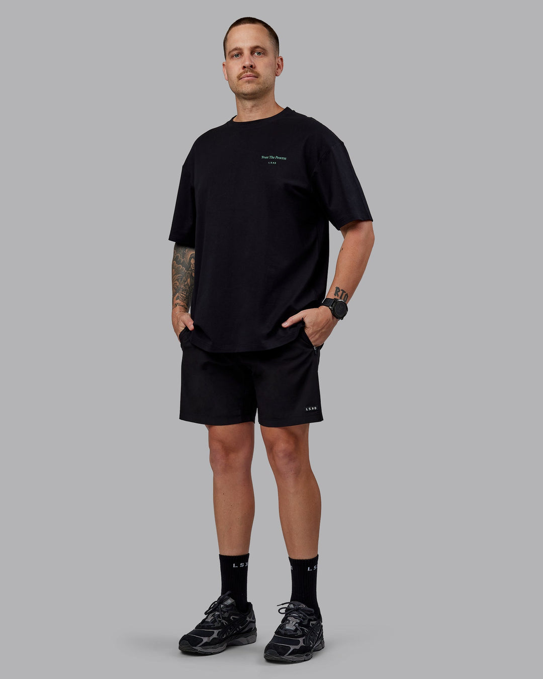 Man wearing Unisex Trust The Process 2.0 FLXCotton Tee Oversize - Black-Impact Green