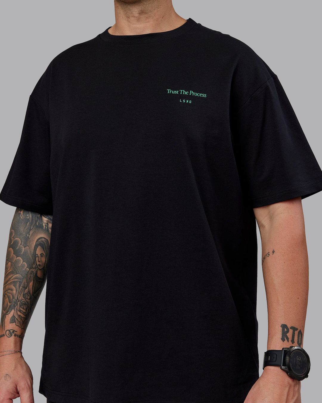 Man wearing Unisex Trust The Process 2.0 FLXCotton Tee Oversize - Black-Impact Green