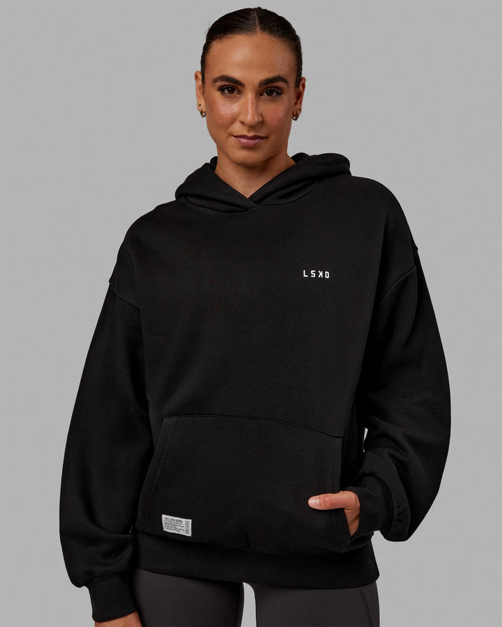 Woman wearing Unisex VS6 Hoodie Oversize - Black-White