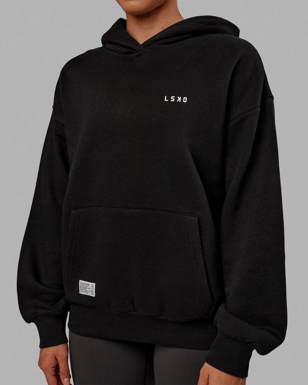 Woman wearing Unisex VS6 Hoodie Oversize - Black-White