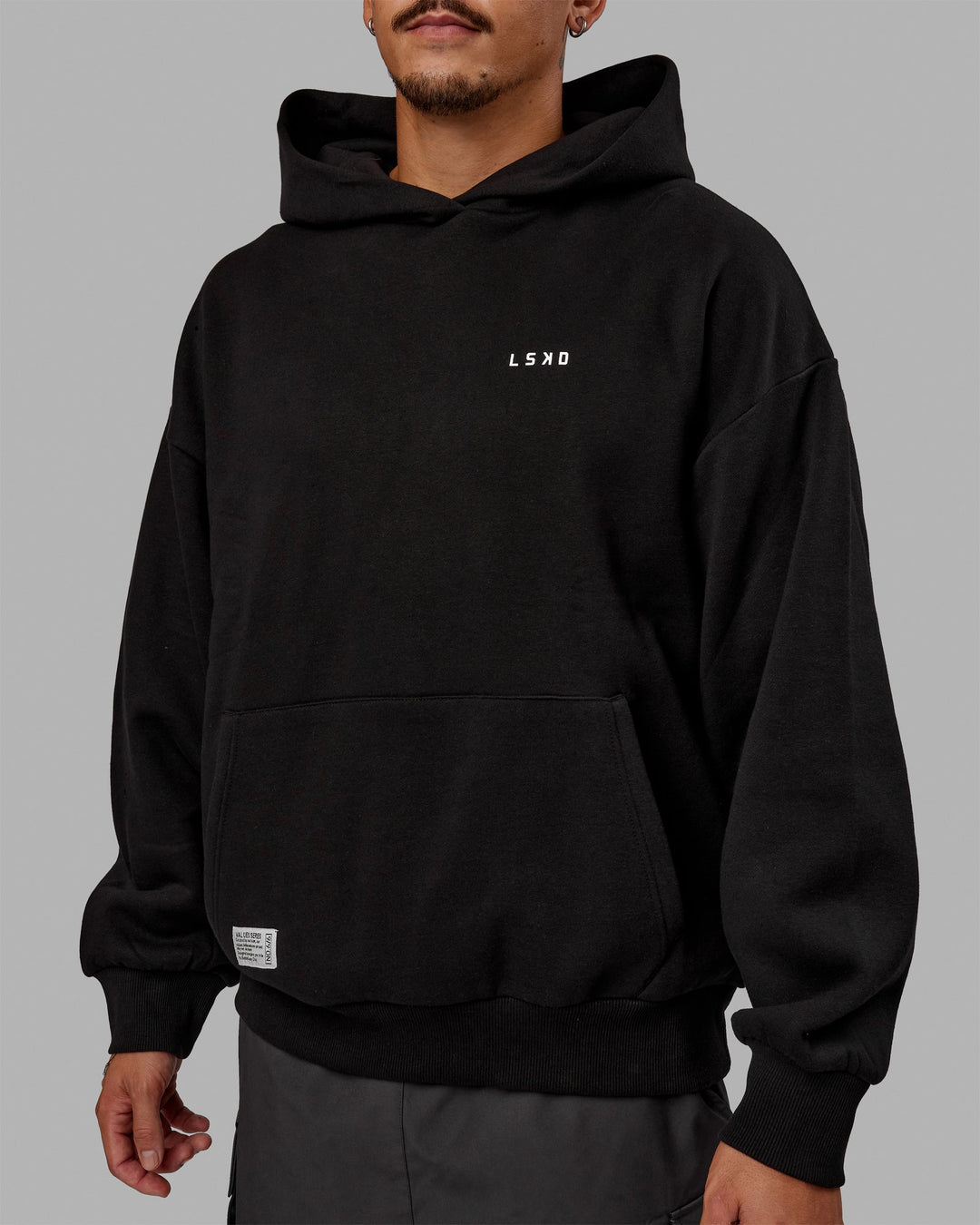 Man wearing Unisex VS6 Hoodie Oversize - Black-White