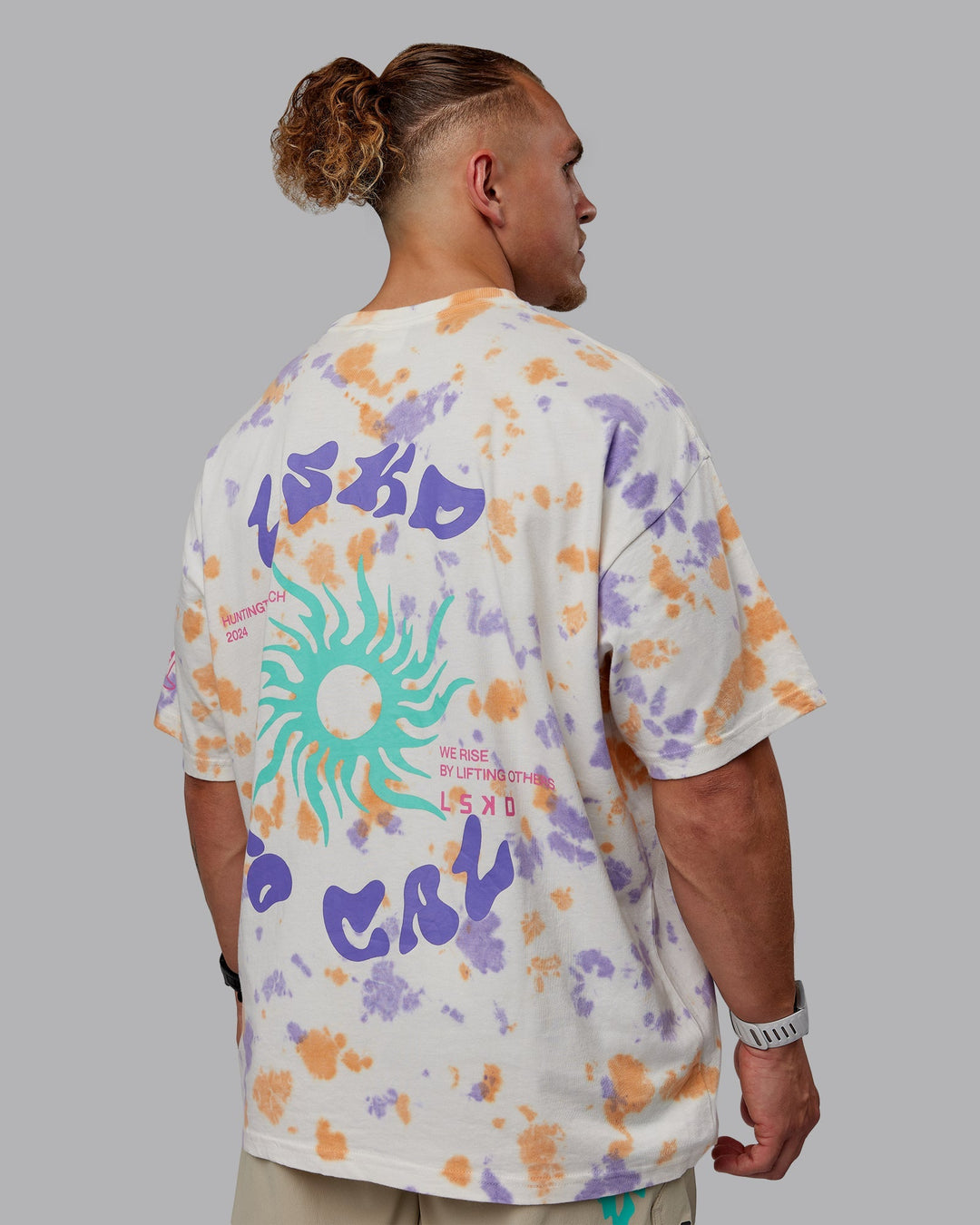 Man wearing Unisex Washed Huntington 24 Heavyweight Tee Oversize - Tie Dye Tangerine-Dahlia Purple