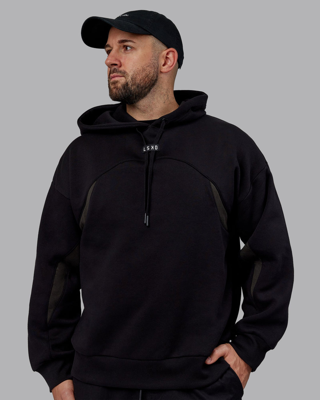 Man wearing Unisex Y2K Concept Panel Hoodie - Black-Black-Pirate Black