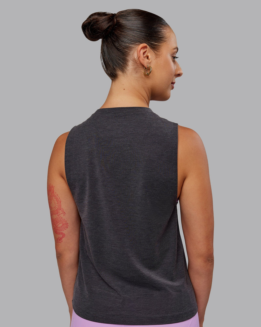 Woman wearing Unleash 1% Better Training Tank - Charcoal Marl-White