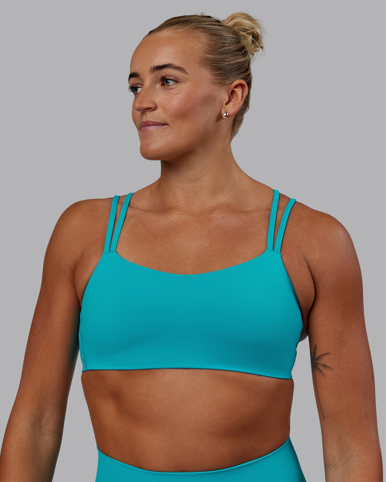 Woman wearing Vantage Sports Bra - Blue Bird