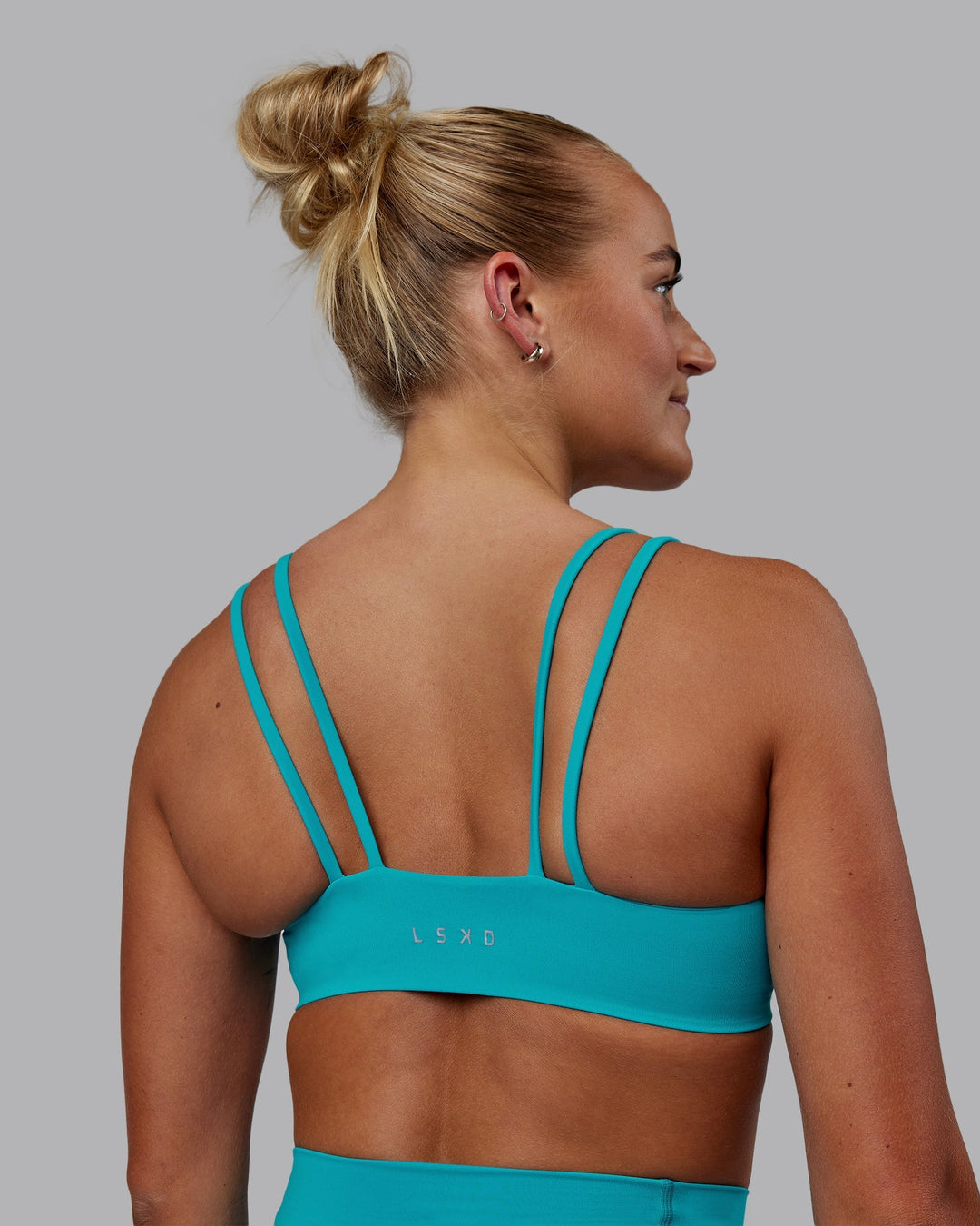 Woman wearing Vantage Sports Bra - Blue Bird