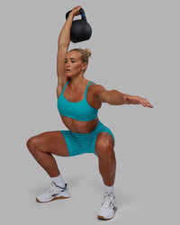Woman wearing Vantage Sports Bra - Blue Bird