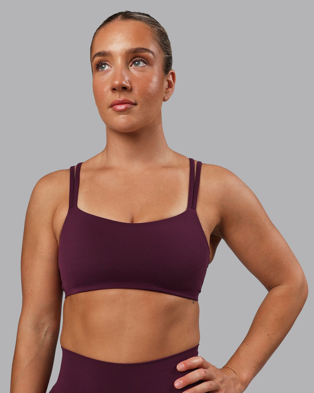 Woman wearing Vantage Sports Bra - Cherry Lacquer