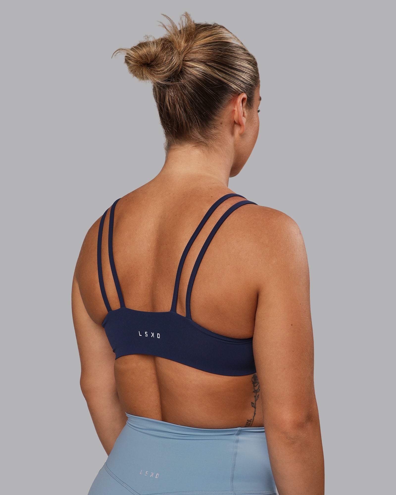 Woman wearing Vantage Sports Bra - Future Navy