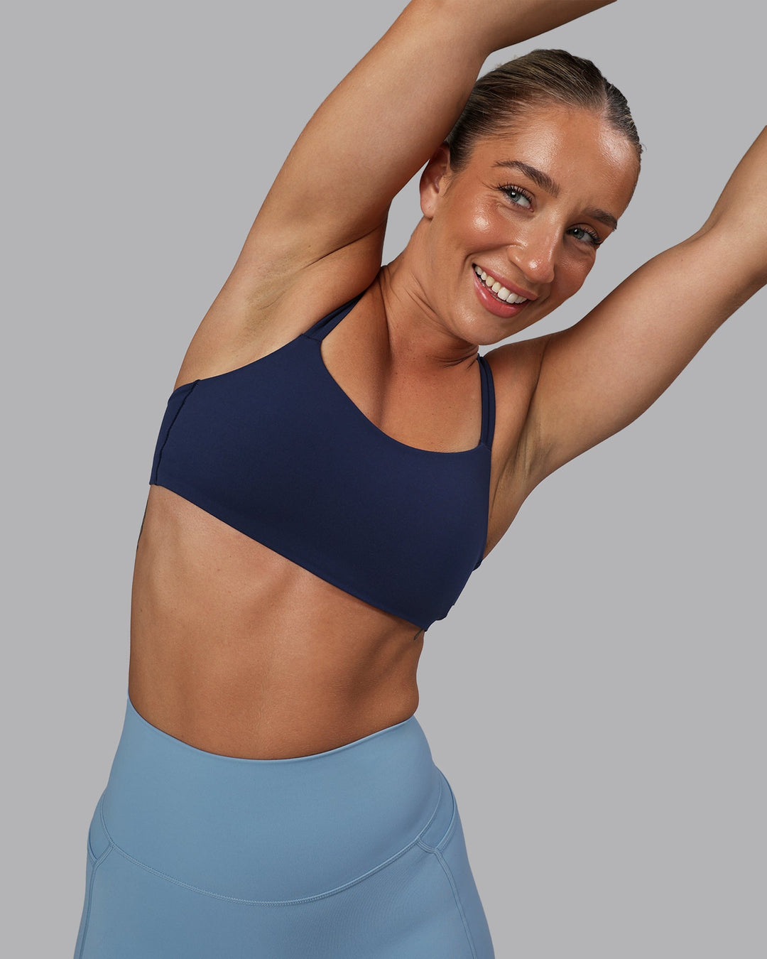 Woman wearing Vantage Sports Bra - Future Navy