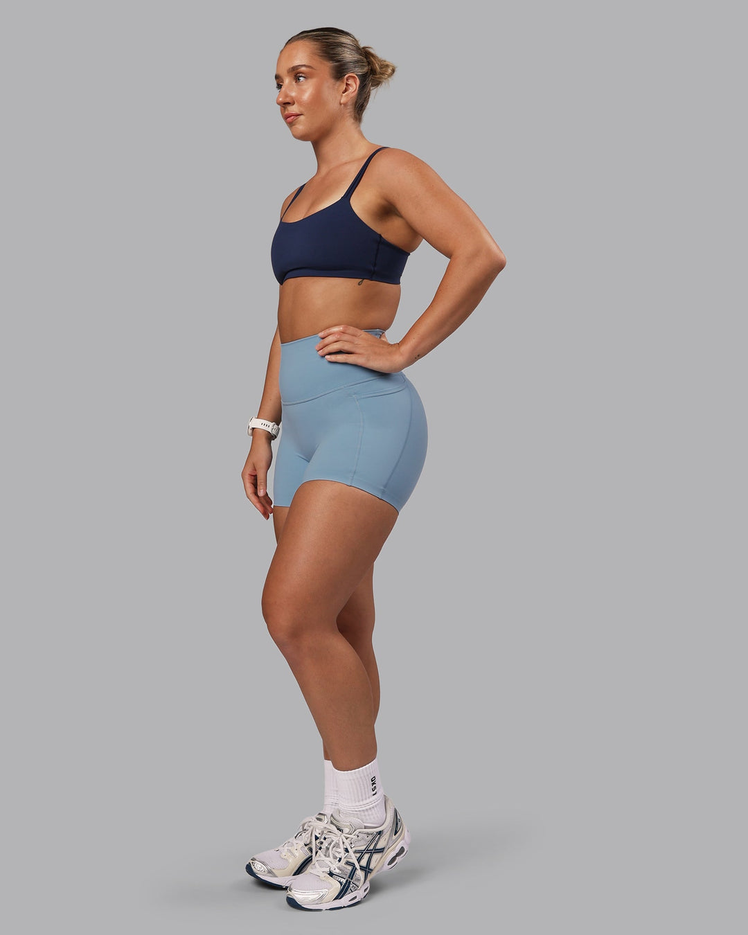 Woman wearing Vantage Sports Bra - Future Navy