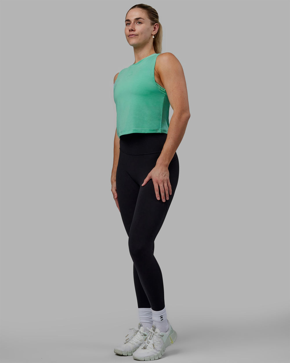 Woman wearing Vital Cropped Training Tank - Cockatoo