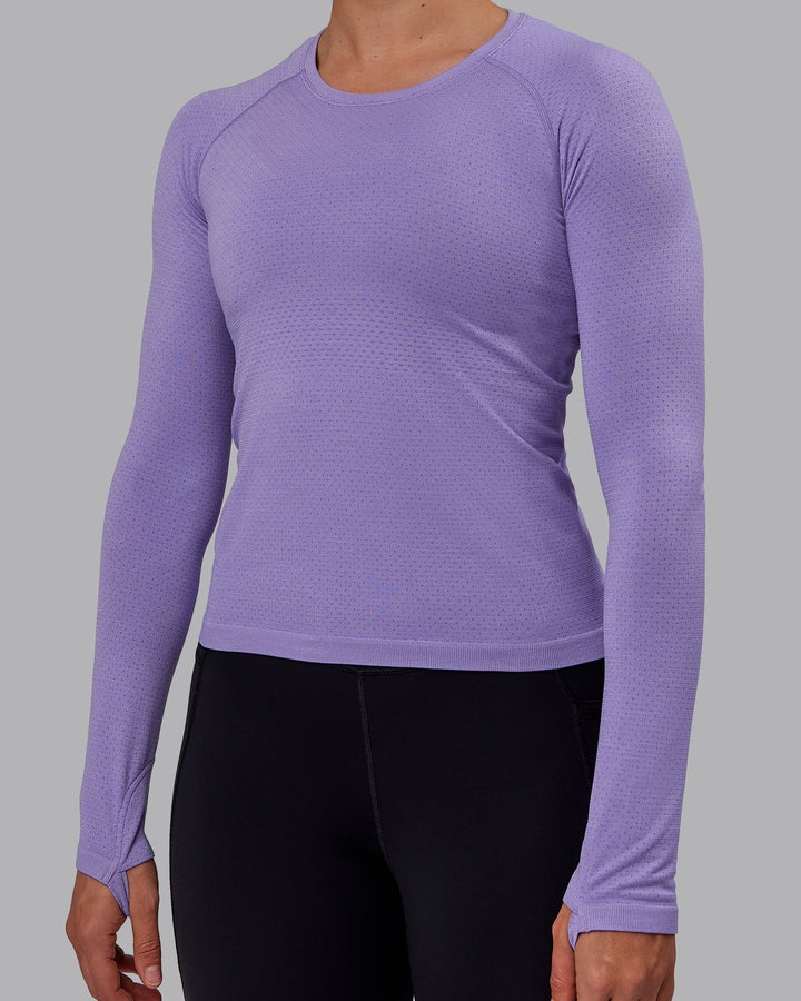 Woman wearing AeroFLX+ Seamless Long Sleeve Tee - Dahlia Purple Marl
