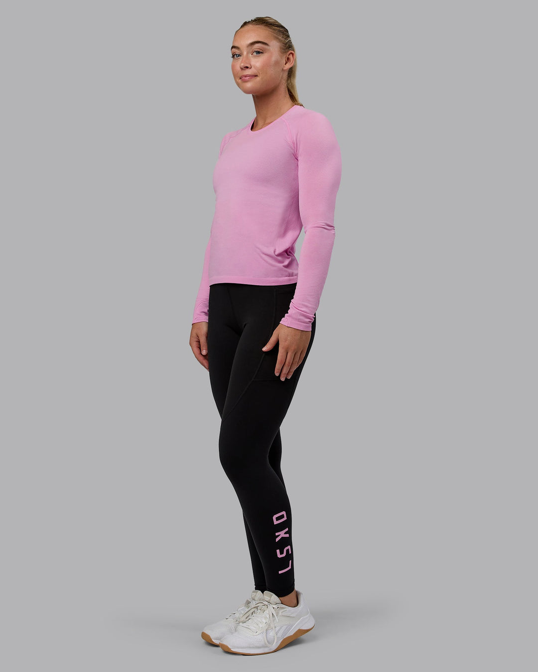 Woman wearing AeroFLX+ Seamless Long Sleeve Tee - Piroutte/Bubblegum