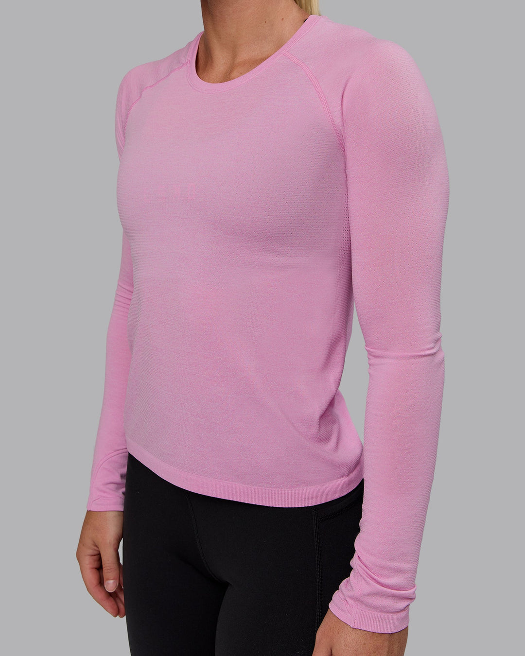 Woman wearing AeroFLX+ Seamless Long Sleeve Tee - Piroutte/Bubblegum