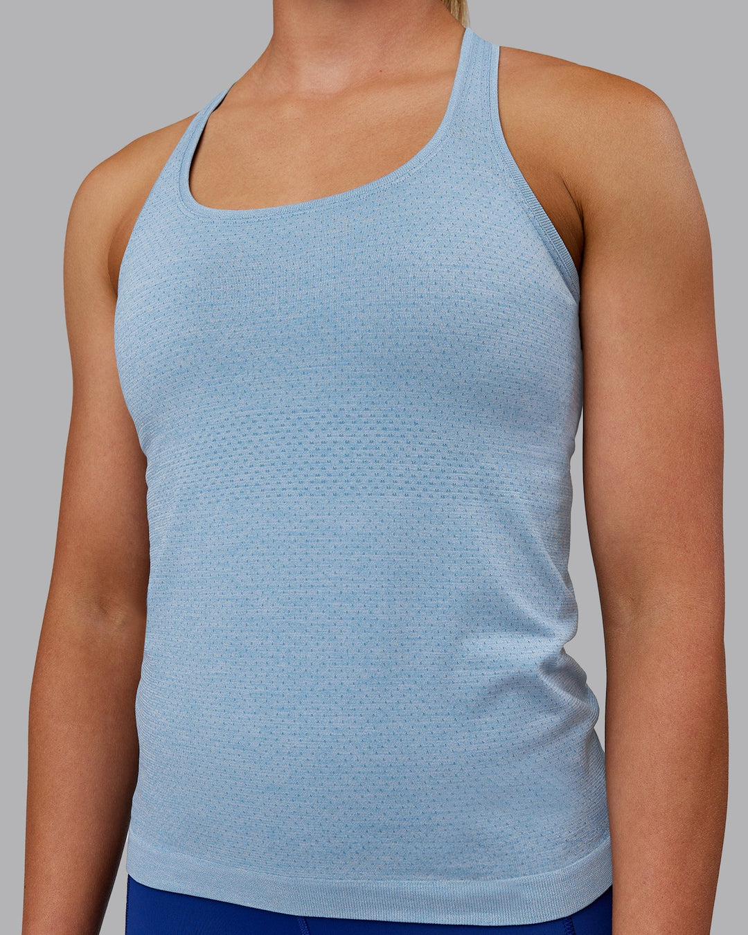 Woman wearing AeroFLX+ Seamless Tank - Elemental Blue/Ice Blue