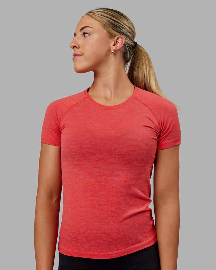 Woman wearing AeroFLX+ Seamless Tee - Fuchsia Pink/Grenadine
