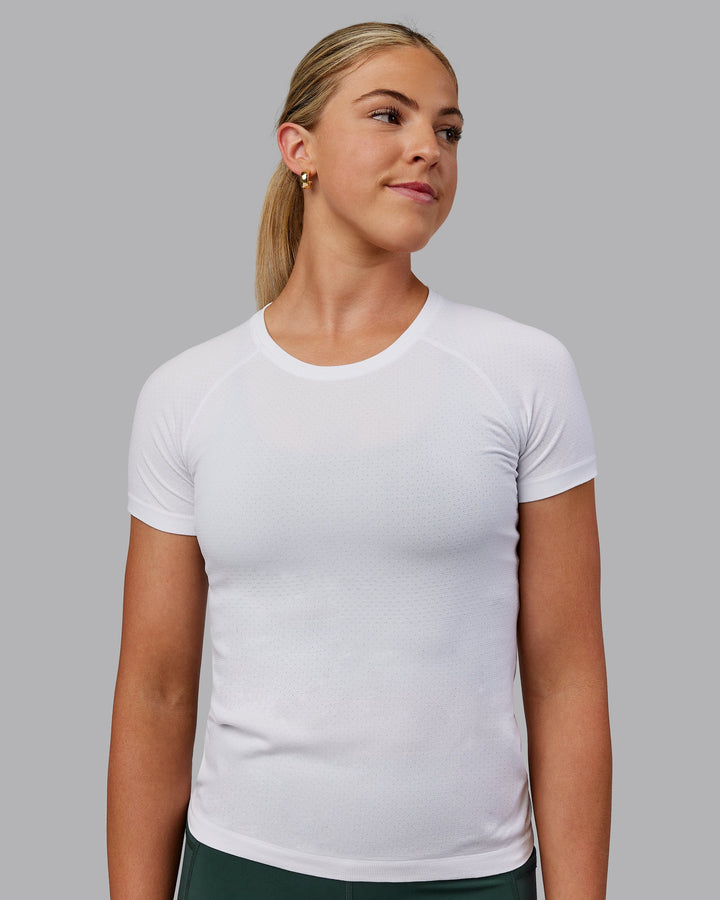 Woman wearing AeroFLX+ Seamless Tee - White/White
