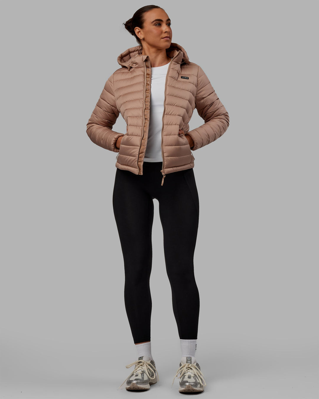 Woman wearing All Day Puffer Jacket - Desert