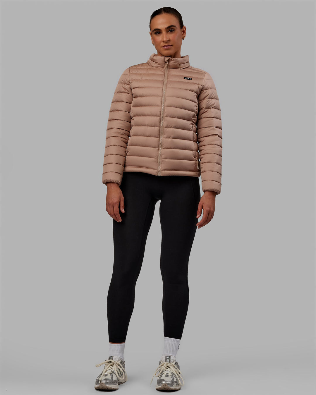 Woman wearing All Day Puffer Jacket - Desert