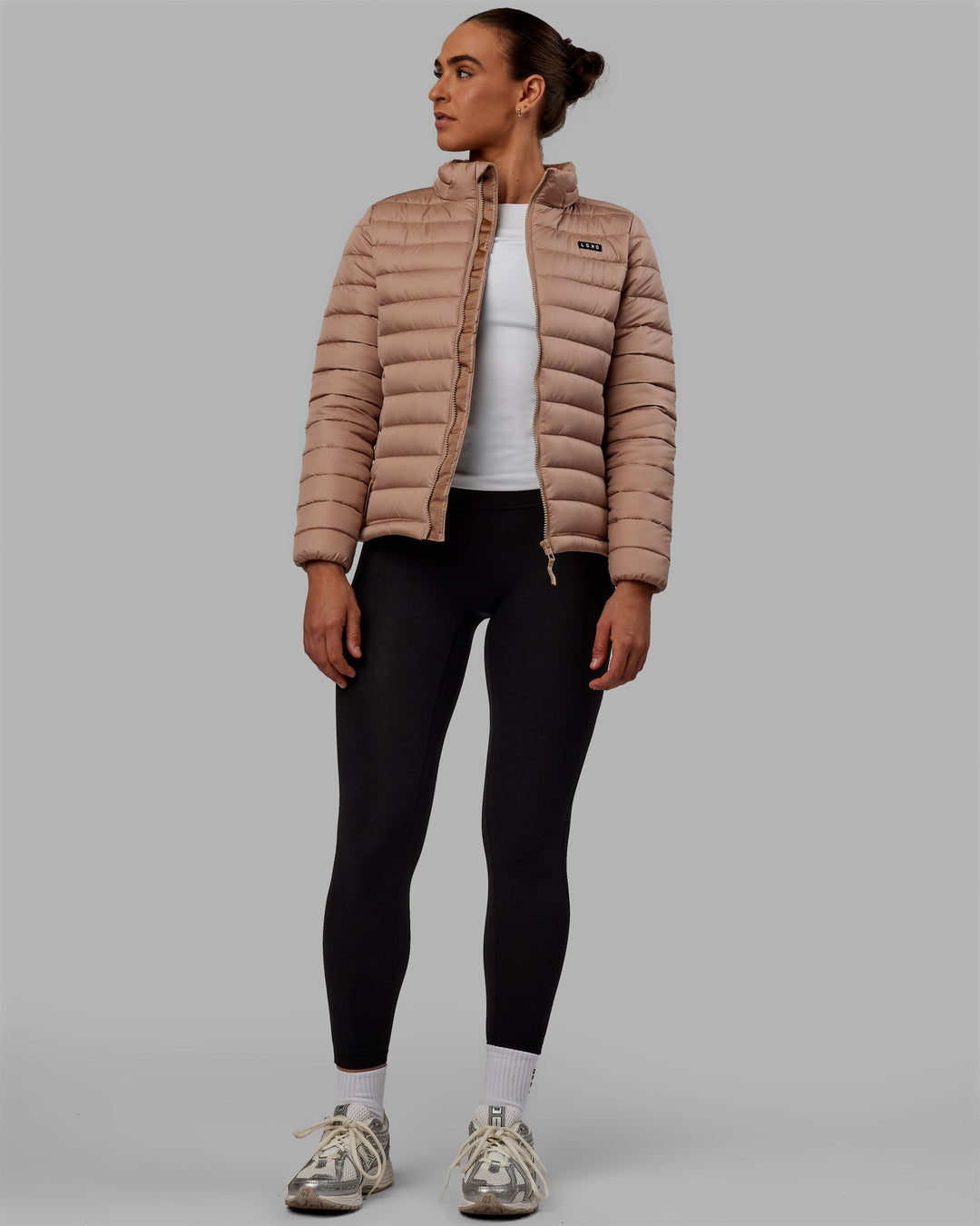 Woman wearing All Day Puffer Jacket - Desert