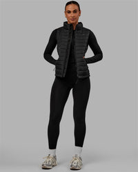 Woman wearing All Day Puffer Vest - Black | Thumbnail Index: 1