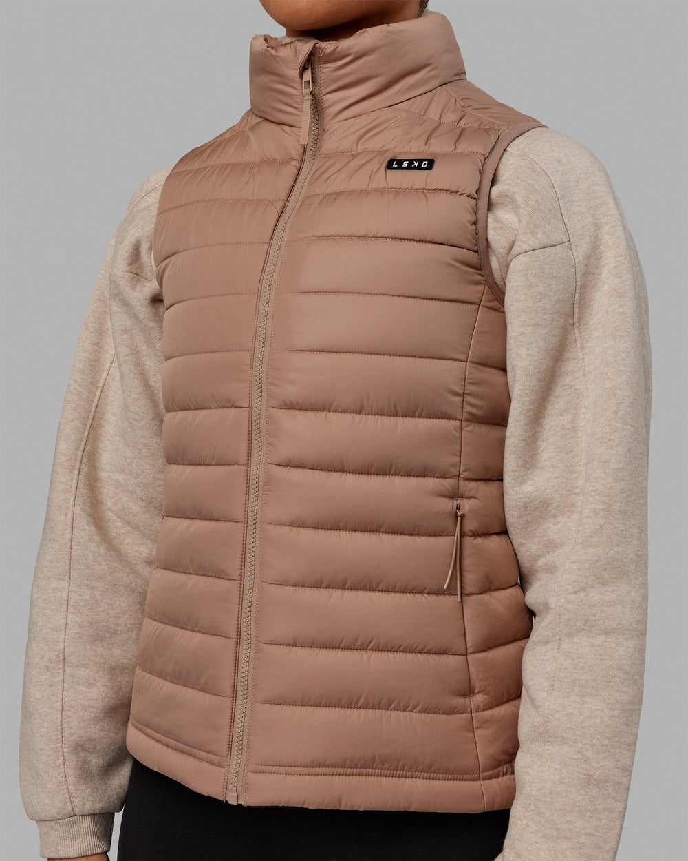 Woman wearing All Day Puffer Vest - Desert