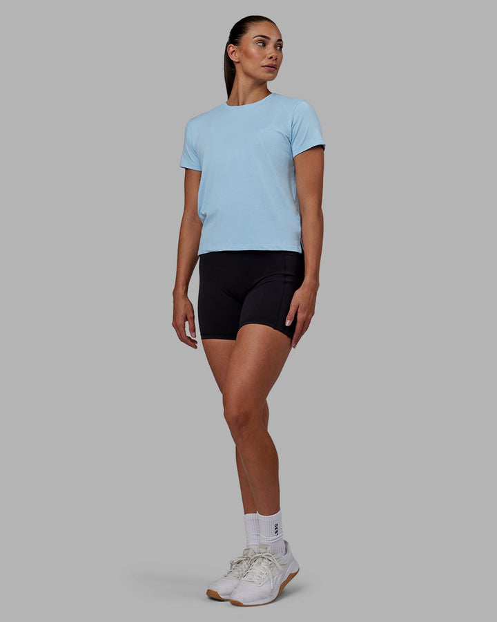 Woman wearing Deluxe PimaFLX Tee - Glacial Blue
