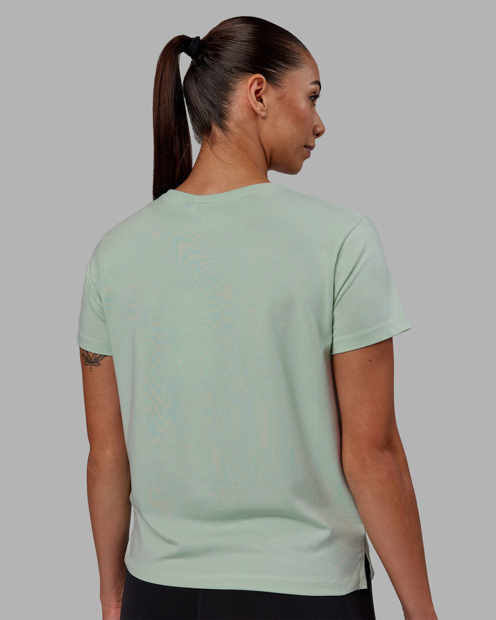 Woman wearing Deluxe PimaFLX Tee - Surf Spray
