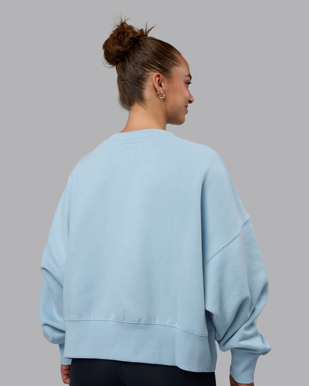 Woman wearing MVP Oversized Sweater - Glacial Blue