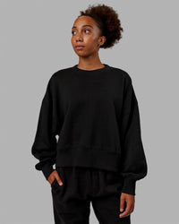Woman wearing MVP Oversized Sweater - Black | Thumbnail Index: 1