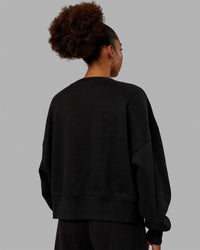 Woman wearing MVP Oversized Sweater - Black | Thumbnail Index: 4