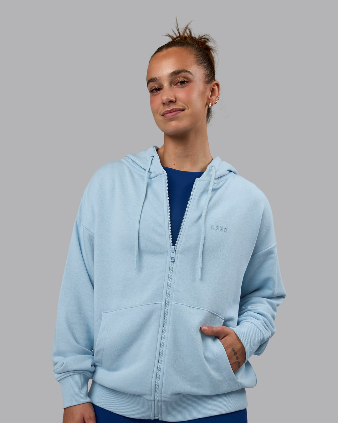 Woman wearing MVP Zip Through Hoodie - Glacial Blue