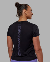 Woman wearing Pace Keep on Running Tee - Black-Dahlia Purple
