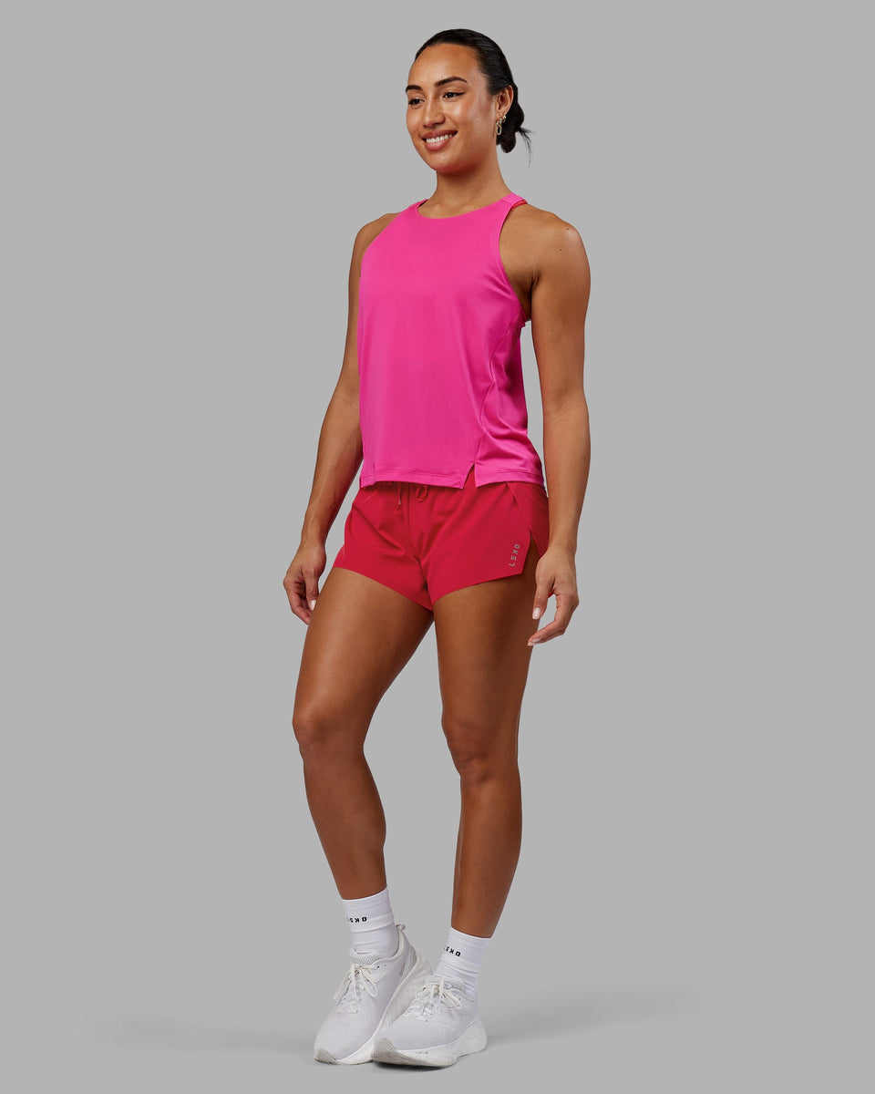 Woman wearing Pace Running Tank - Ultra Pink