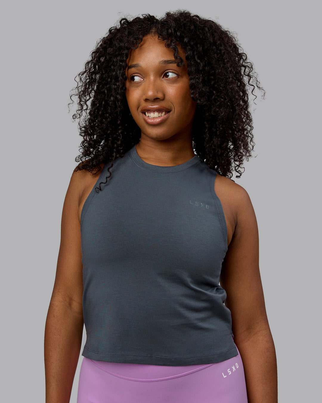 Woman wearing Deluxe PimaFLX Tank - Turbulence