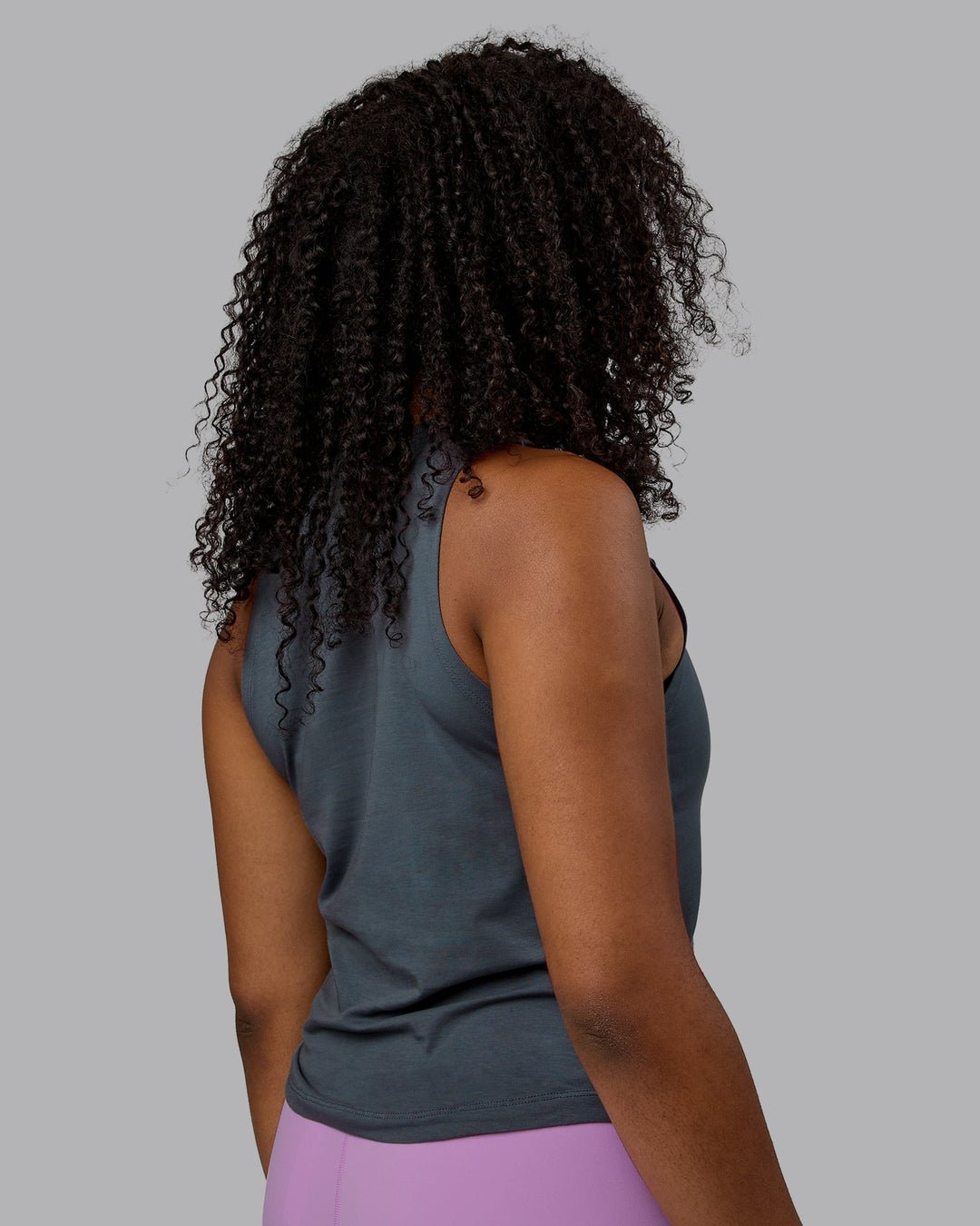 Woman wearing Deluxe PimaFLX Tank - Turbulence