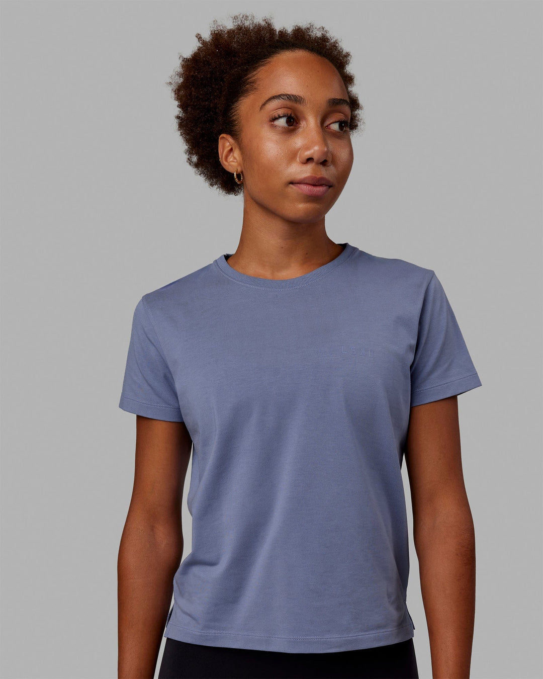 Woman wearing Deluxe PimaFLX Tee - Blue Ice