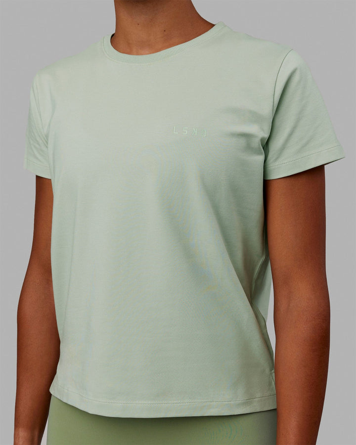 Woman wearing Deluxe PimaFLX Tee - Metal
